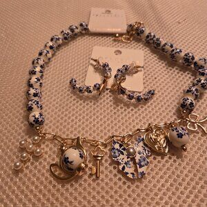 Blue/white floral bead charm necklace with matching hoop & bow detail earrings